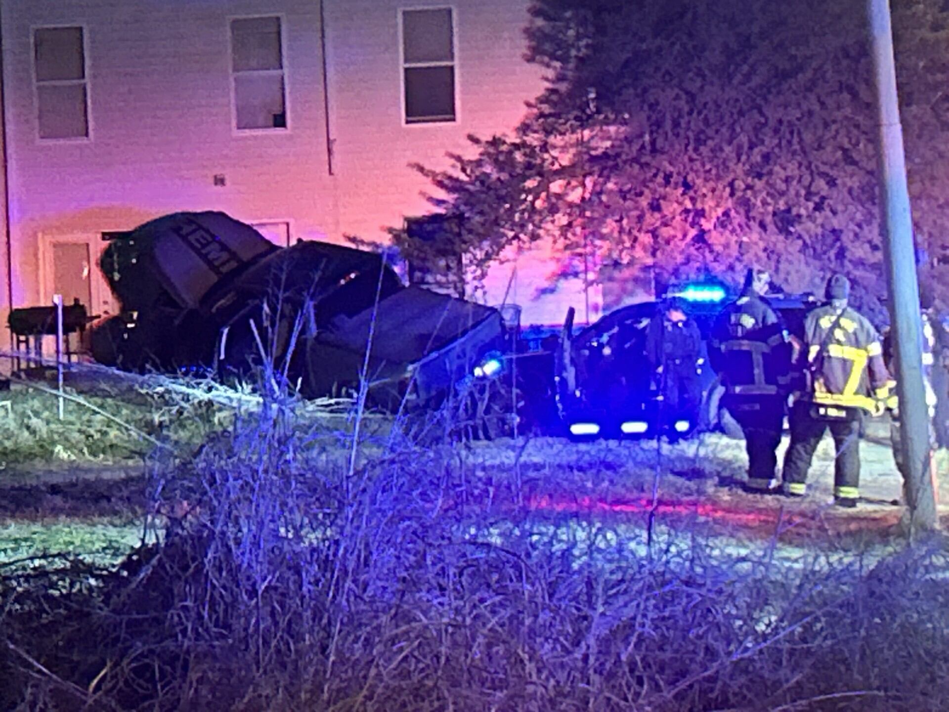 1 detained after driver crashes through gate of downtown apartment complex