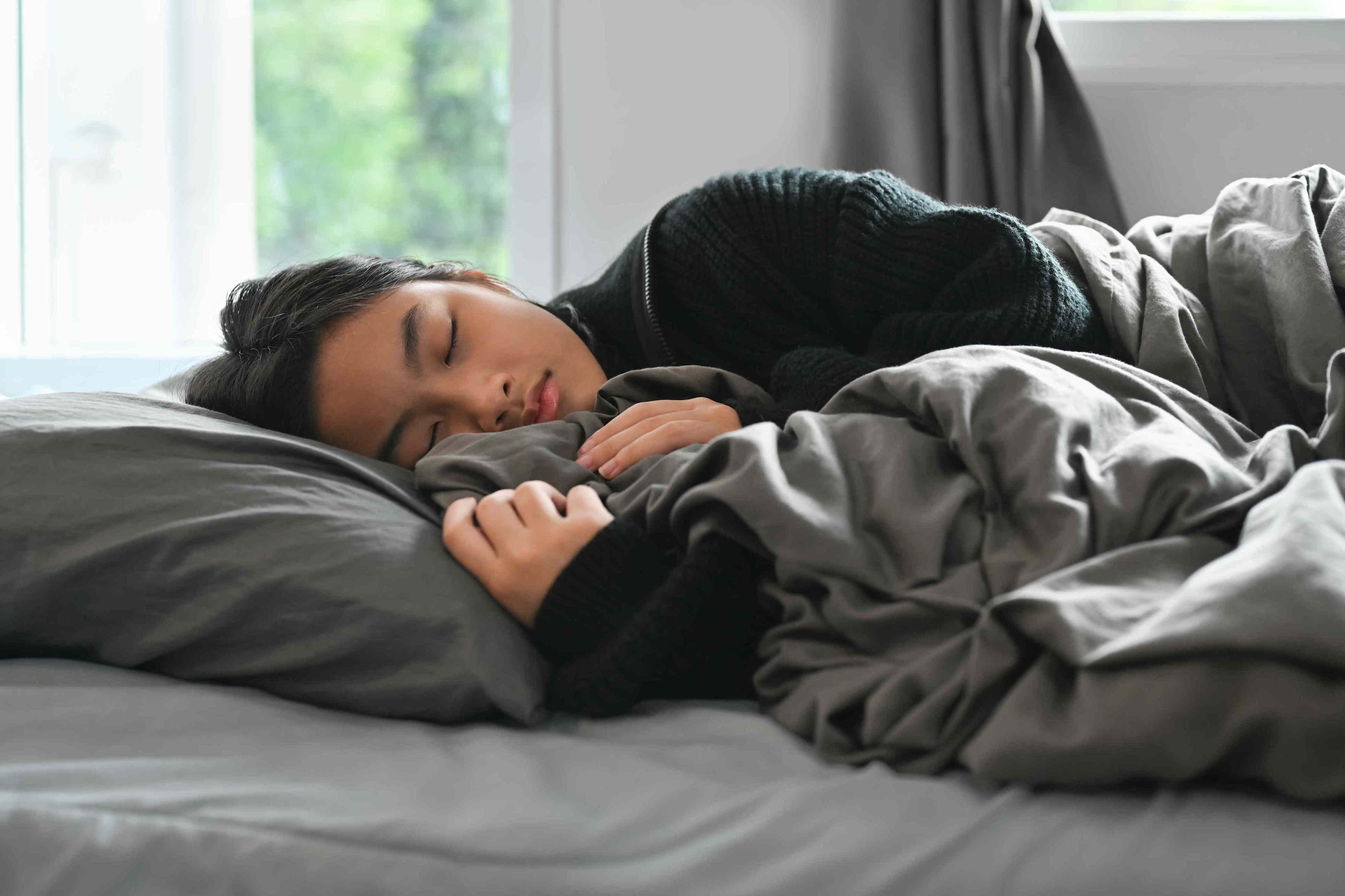 Your teen’s weekend sleep-in might be exactly what they need, according ...