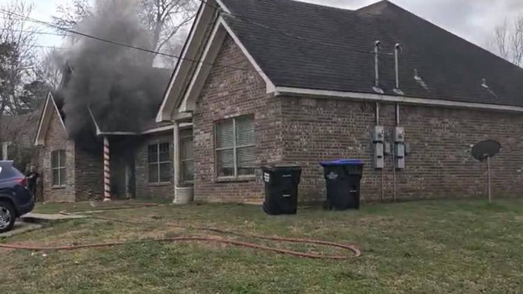 Officials: 4 displaced after unattended candle leads to house fire in ...