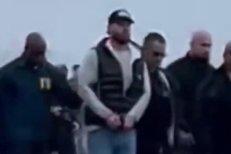 Ex-Olympics star pictured in handcuffs for first time as he arrives in ...