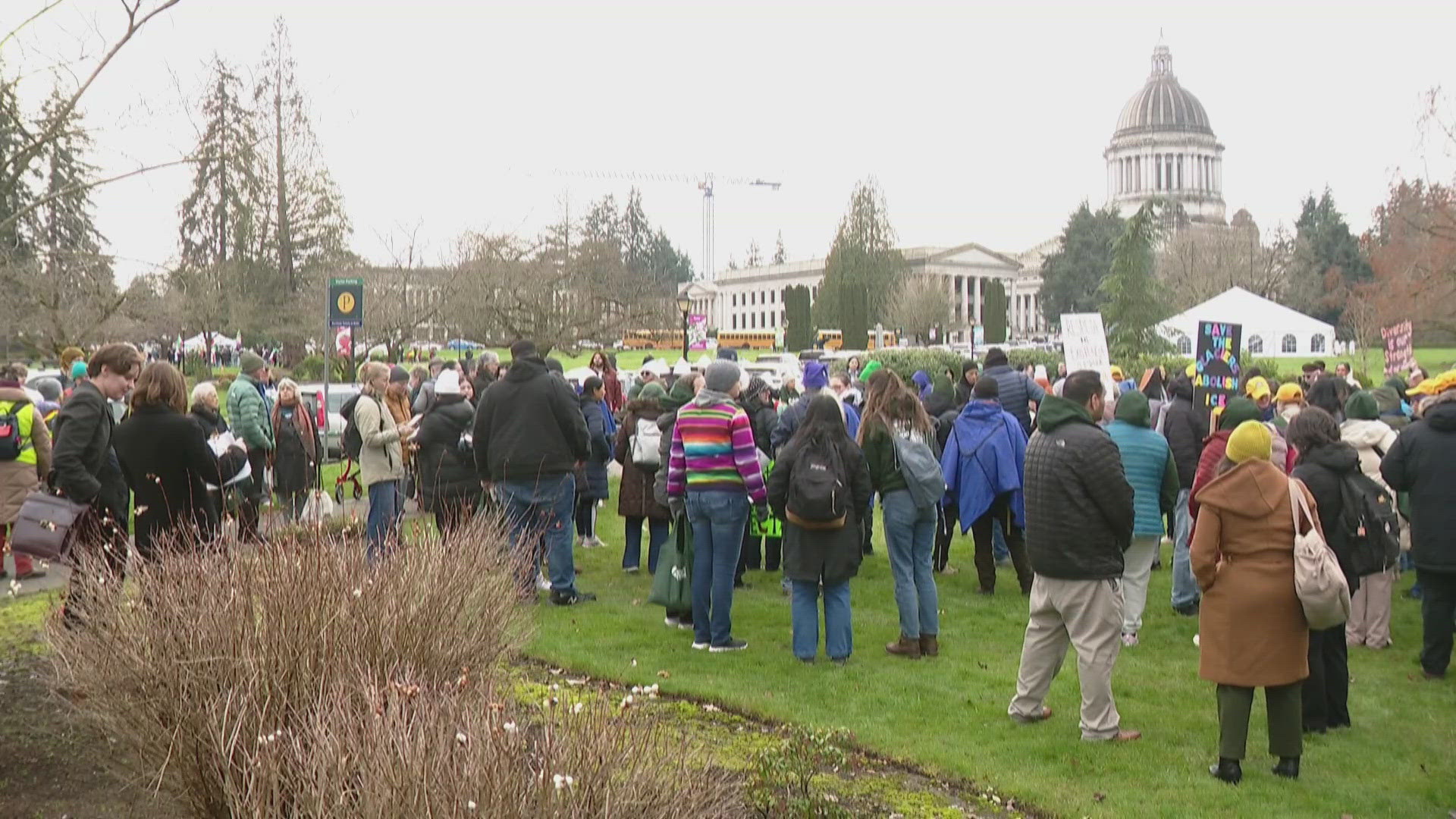 Immigrant advocates rally in WA, push funding for deportation hotline ...