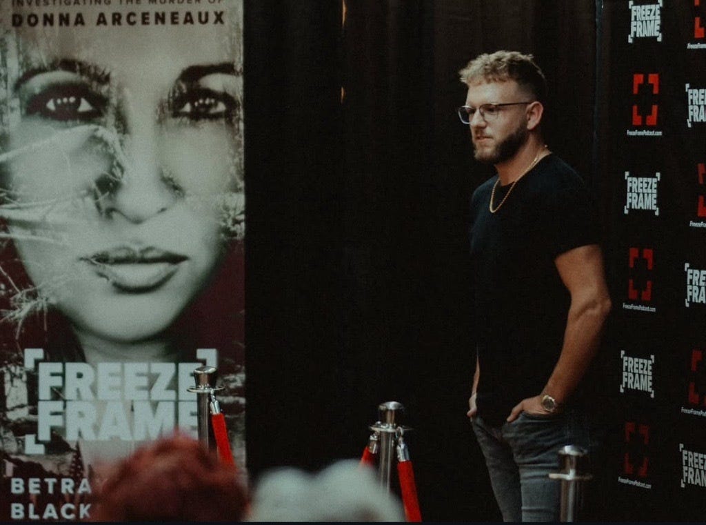 Tucker Simmons is pictured at a release and listening party in Franklinton, Louisiana, for his podcast, "Freeze Frame," which explores the cold case murder of his aunt, Donna Arceneaux.