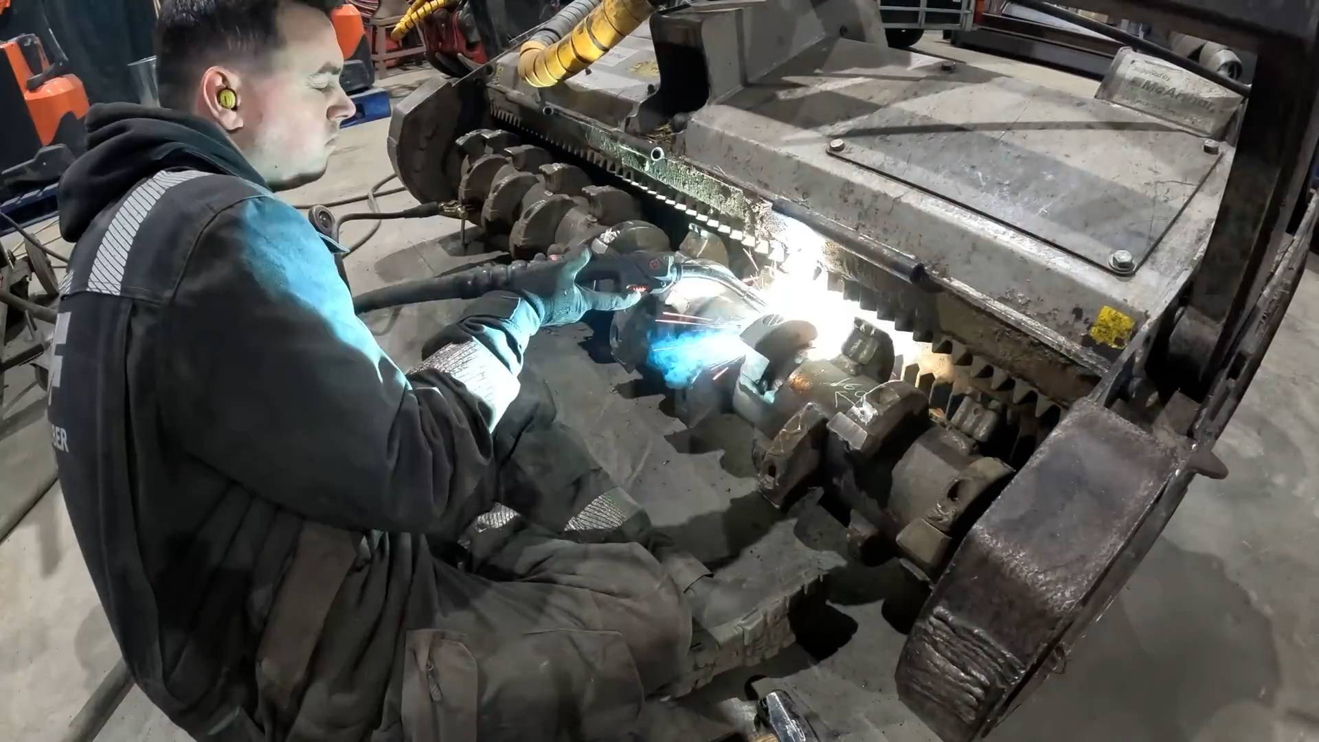 Repairing heavy equipment in the workshop