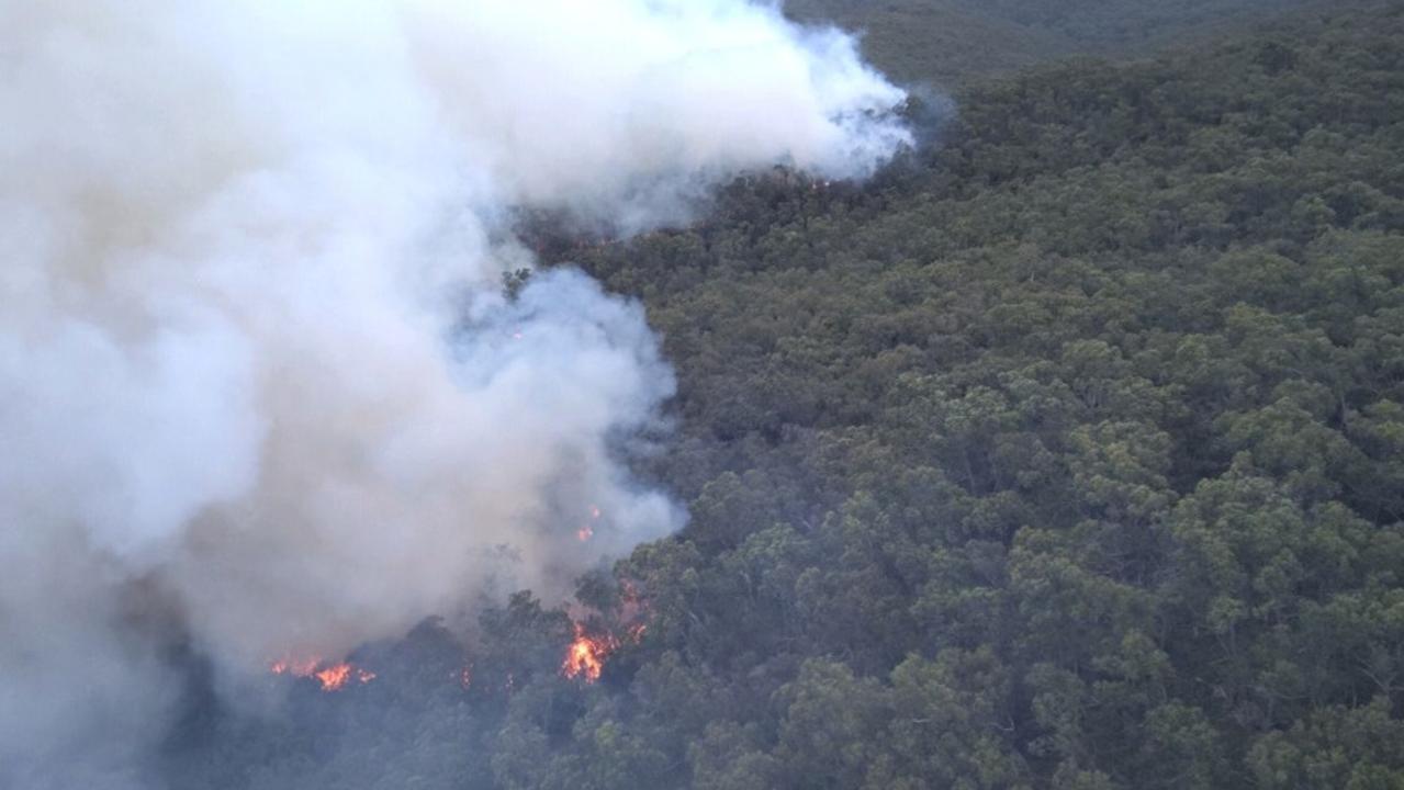 'Take shelter': Bushfire jumps containment lines