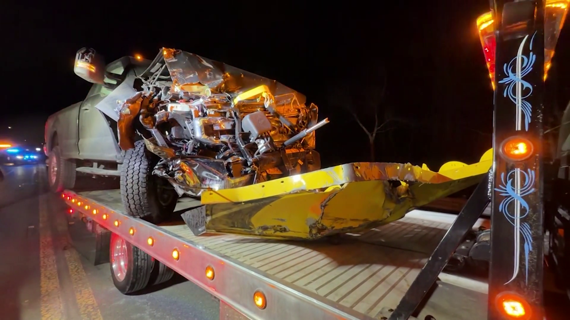Plow collides with truck carrying police cruiser in Mass. town