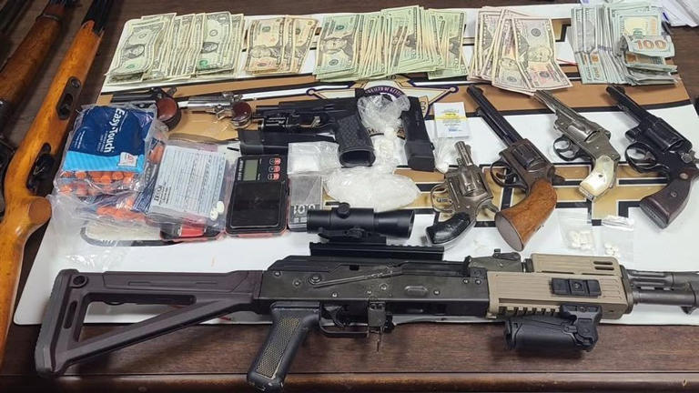 Drug raid nets two arrests, seizure of illegal drugs, guns and money in ...