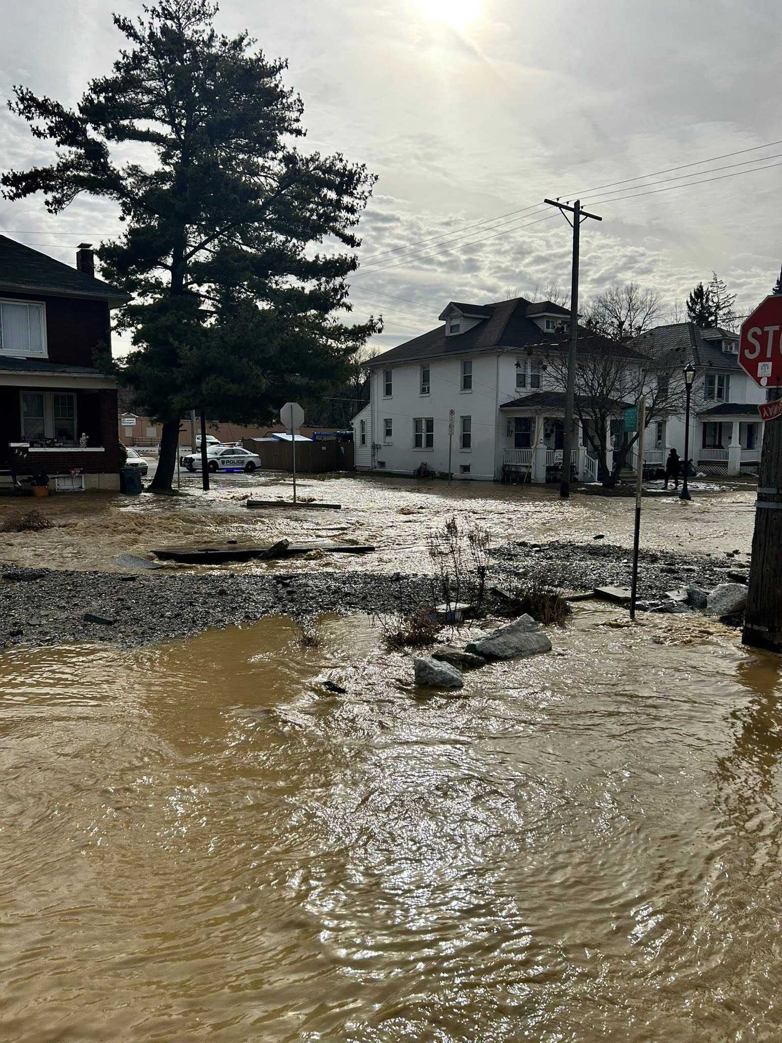 Water main break floods roads, affecting more than 100 customers