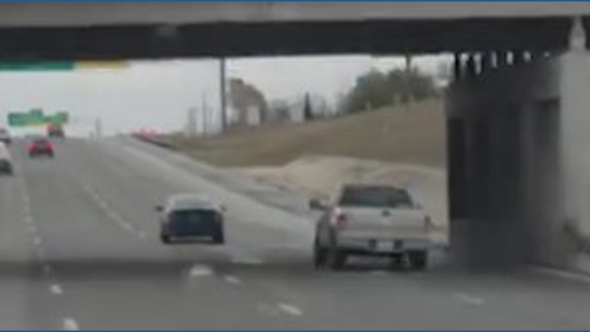 Caught on camera: Truck crashes into guardrail, knocking down freeway ...