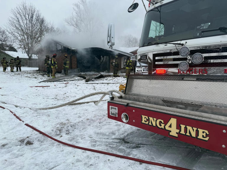 Elderly woman rescued from burning home in Rogers