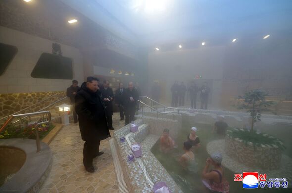 Kim Jong Un poses with spa-goers in latest tourism propaganda stunt