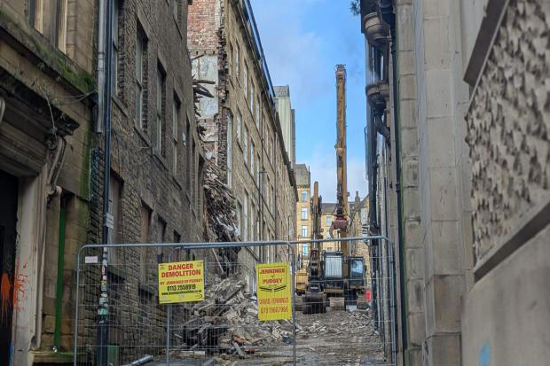 Dramatic photos show shocking state of collapsed building as demolition ...