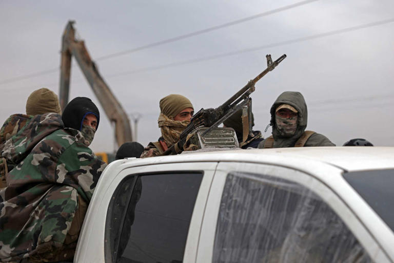 Syrian government security forces patrol near a prison on the outskirts of Raqqa on Thursday, amid renewed tensions between Damascus and Kurdish-led forces over control and governance of the region. Photo: AFP
