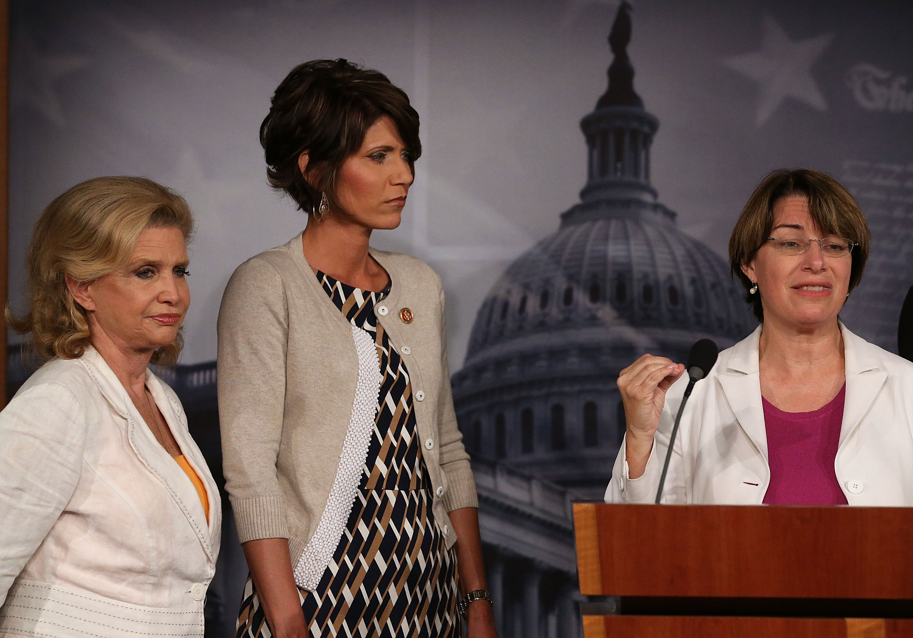 Sen. Amy Klobuchar (D-Minnesota), right, and Rep. Carolyn B. Maloney (D-New York), left, at a news conference with then-Rep. Kristi L. Noem (R-South Dakota) in 2013.