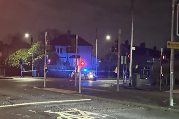 Woman rushed to hospital after being struck by car as road taped off