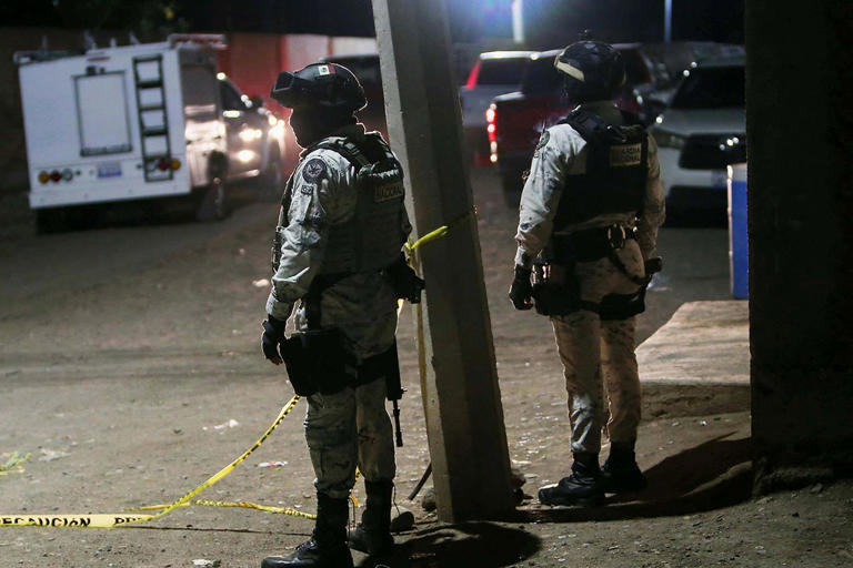 Mario Armas / AFP via Getty Members of the National Guard stand at the crime scene on January 25, 2026.