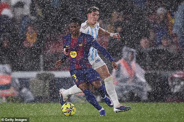 Barcelona's newly-renovated Nou Camp is flooded by heavy rain as ...