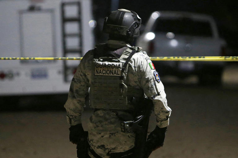 Mario Armas / AFP via Getty A member of the National Guard stands at the crime scene on January 25, 2026