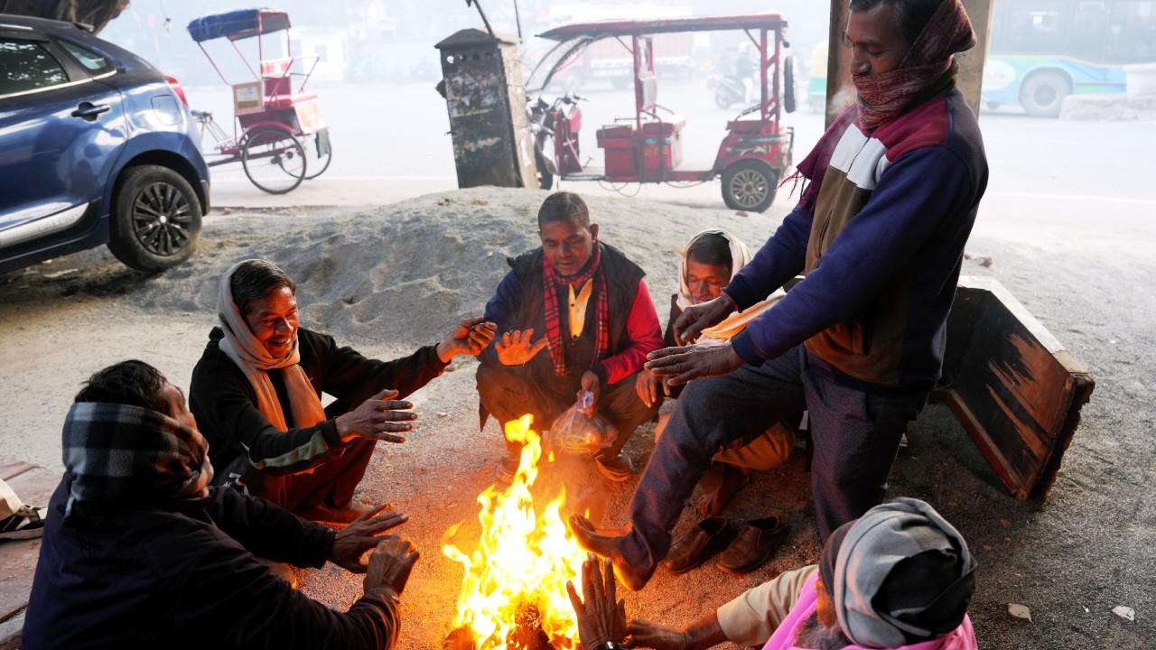 In photos, Delhi shivers under cold weather, air quality remains very poor