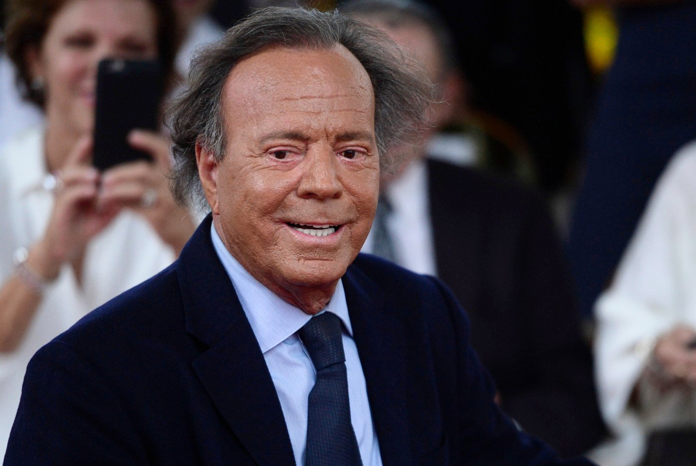 FILE - Spanish singer Julio Iglesias smiles during his star unveiling ceremony at the Walk of Fame in San Juan, Puerto Rico, Thursday, Sept. 29, 2016. (AP Photo/Carlos Giusti, file)