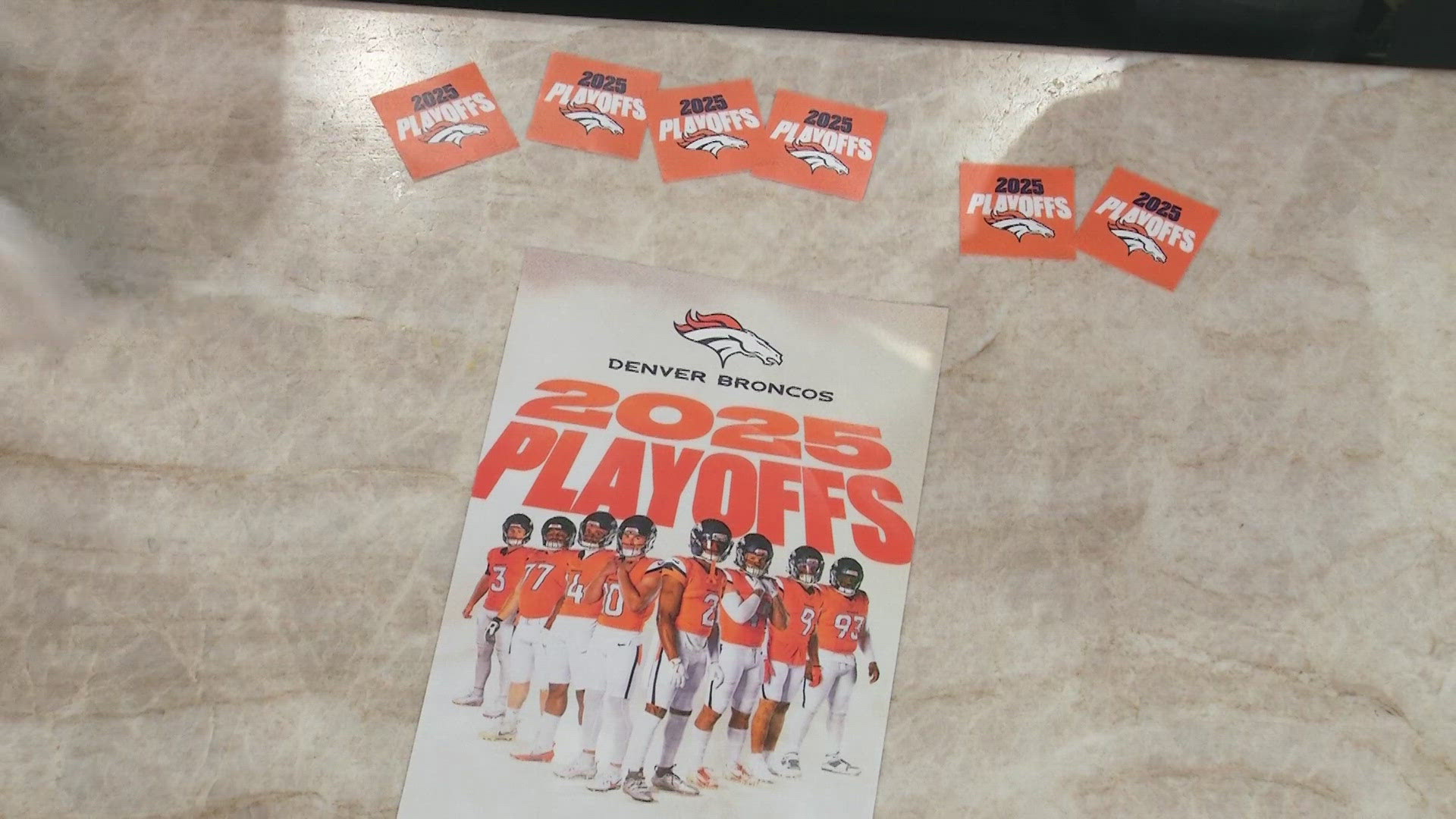 Broncos giving away free playoff posters and decals