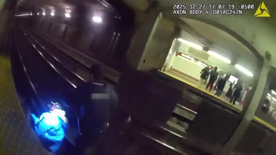 Bodycam video shows daring rescue on Cambridge train tracks