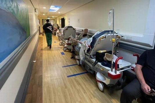 Crying woman asked family to 'let her die' as she endured 33 hour hospital wait More harrowing accounts are emerging from the region's crisis-hit hospitals  A sick and elderly woman who was left lying on a trolley on a hospital corridor for 33 hours told her family she wanted to die.  The harrowing case is the latest to shine a grim light on the chaos surrounding the National Health Service, with hospitals and Accident and Emergencies across the region completely overwhelmed.  Graeme Smith was trying to get his 92-year-old grandma into the hospital from her care home on New Year's Eve after she became unwell. Having waited hours for an ambulance, the paramedics were then caught up in a queue of vehicles trying to get into the hospital.  Graeme explained: 
