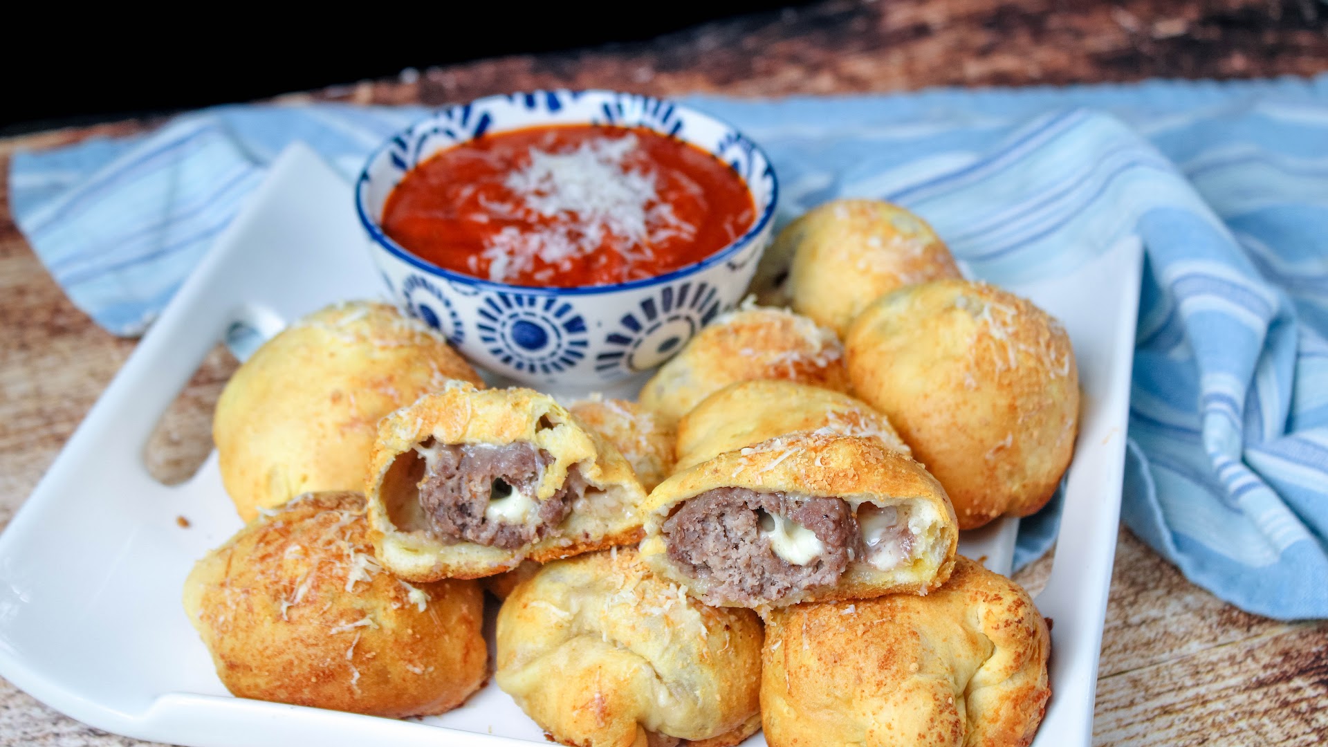 Dipping these double stuffed meatball bubbles in a bit of marinara is ...