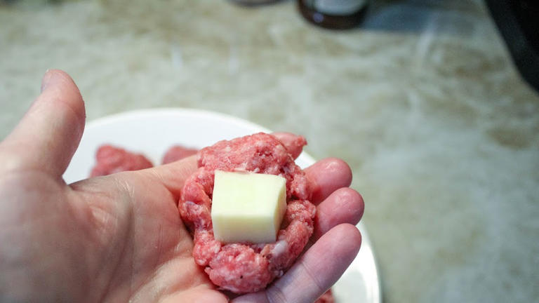 Dipping these double stuffed meatball bubbles in a bit of marinara is ...