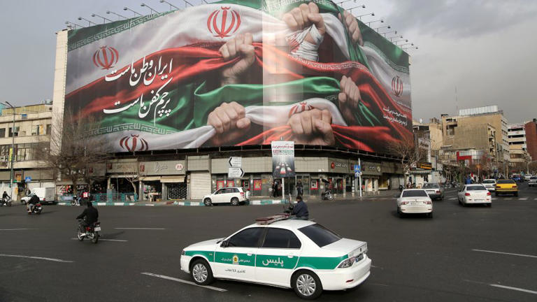 A view of giant banner featuring an image of the Iranian flag at Enghelab Square in Tehran on Thursday. - Fatemeh Bahrami/Anadolu/Getty Images