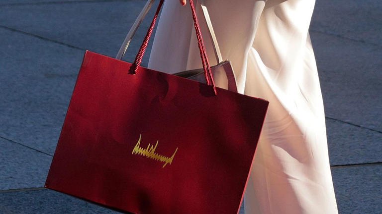 María Corina Machado carries a gift bag with President Donald Trump's signature on it outside the White House on Thursday. - Chip Somodevilla/Getty Images