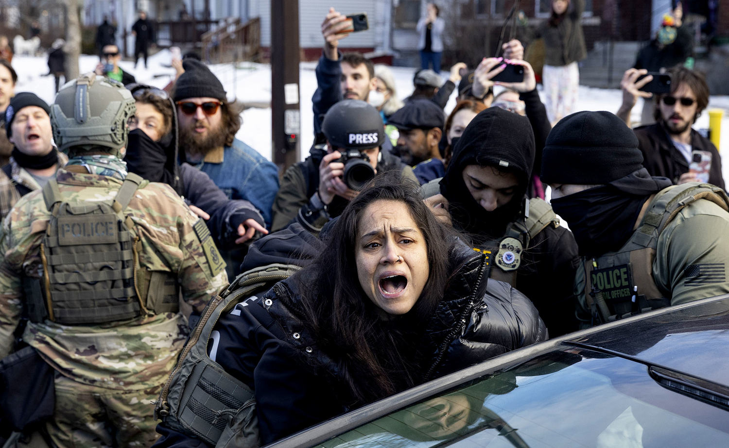 Federal agents have smashed car windows and arrested people they said were obstructing enforcement operations. (Mostafa Bassim / Anadolu via Getty Images)