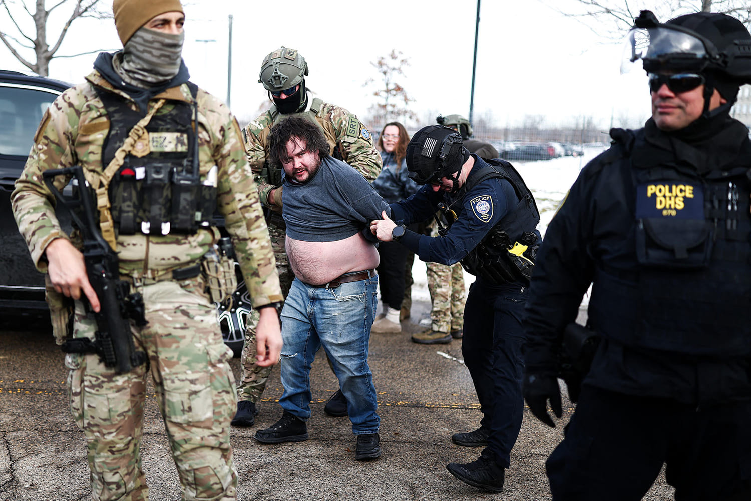 Federal agents regularly detain protesters outside the Whipple federal building. (Charly Triballeau / AFP - Getty Images)
