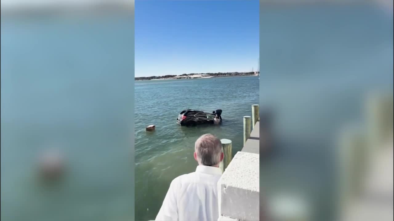 Video shows daring rescue after car goes into water at Back Deck, Bubba's