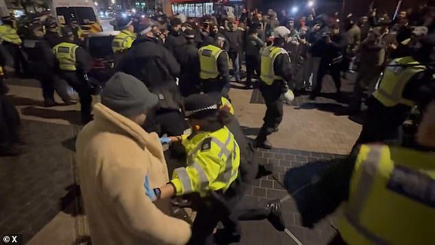 Police clash with protesters outside Iranian embassy in London after ...