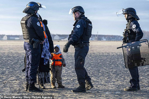 Migrants brave icy cold sea to pile onto overloaded dinghy for latest ...