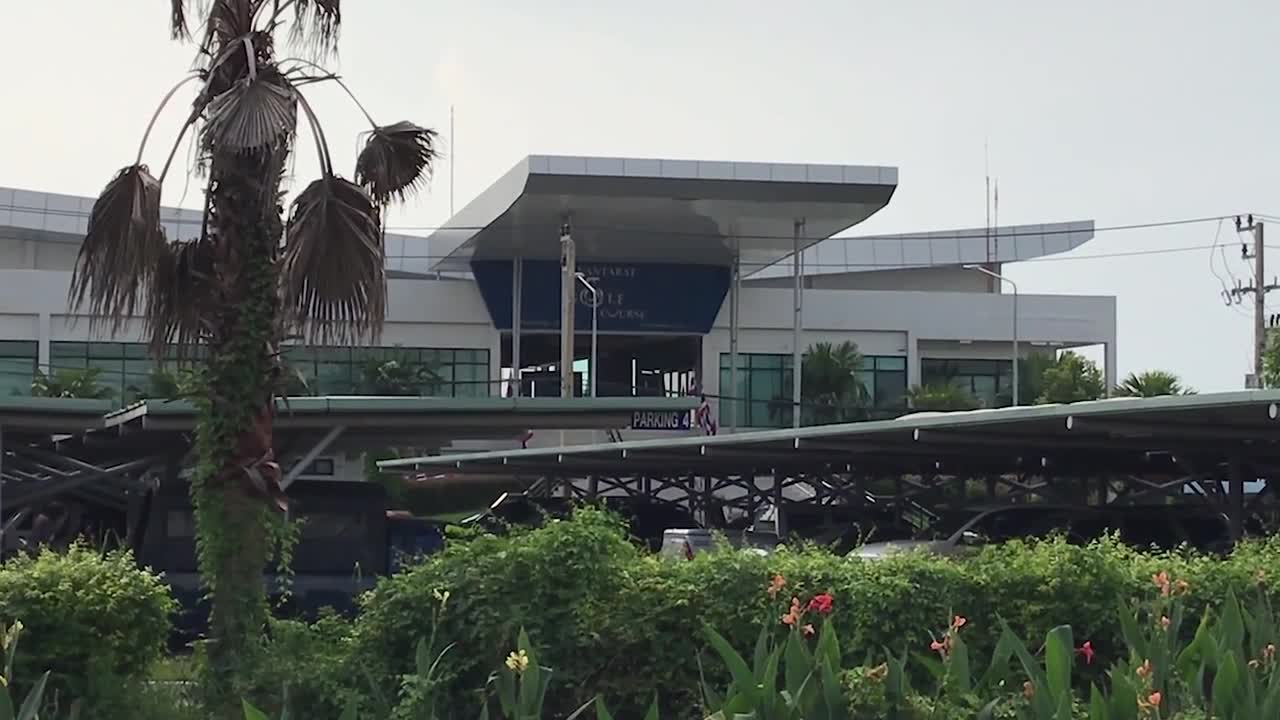 This golf course is built between two runways at an airport in Thailand