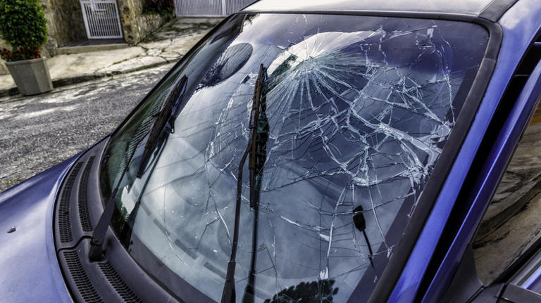 Why did car windshields switch from tempered to laminated glass?