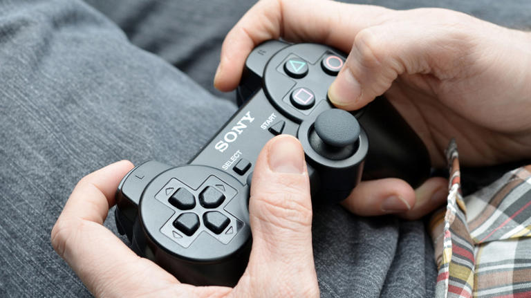 Person playing PlayStation 3