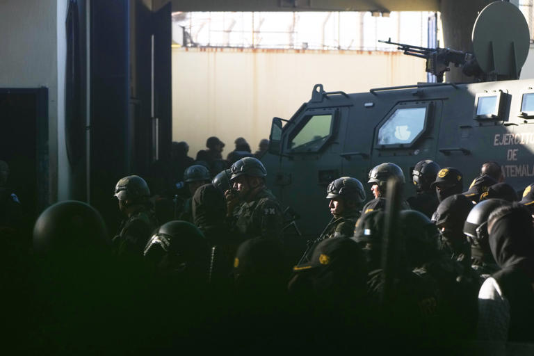 Guatemalan police free hostages in prison as attacks kill 3 officers