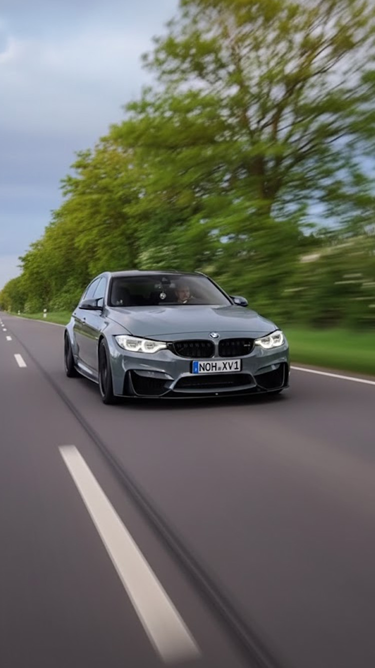 BMW driving captured in motion on the road