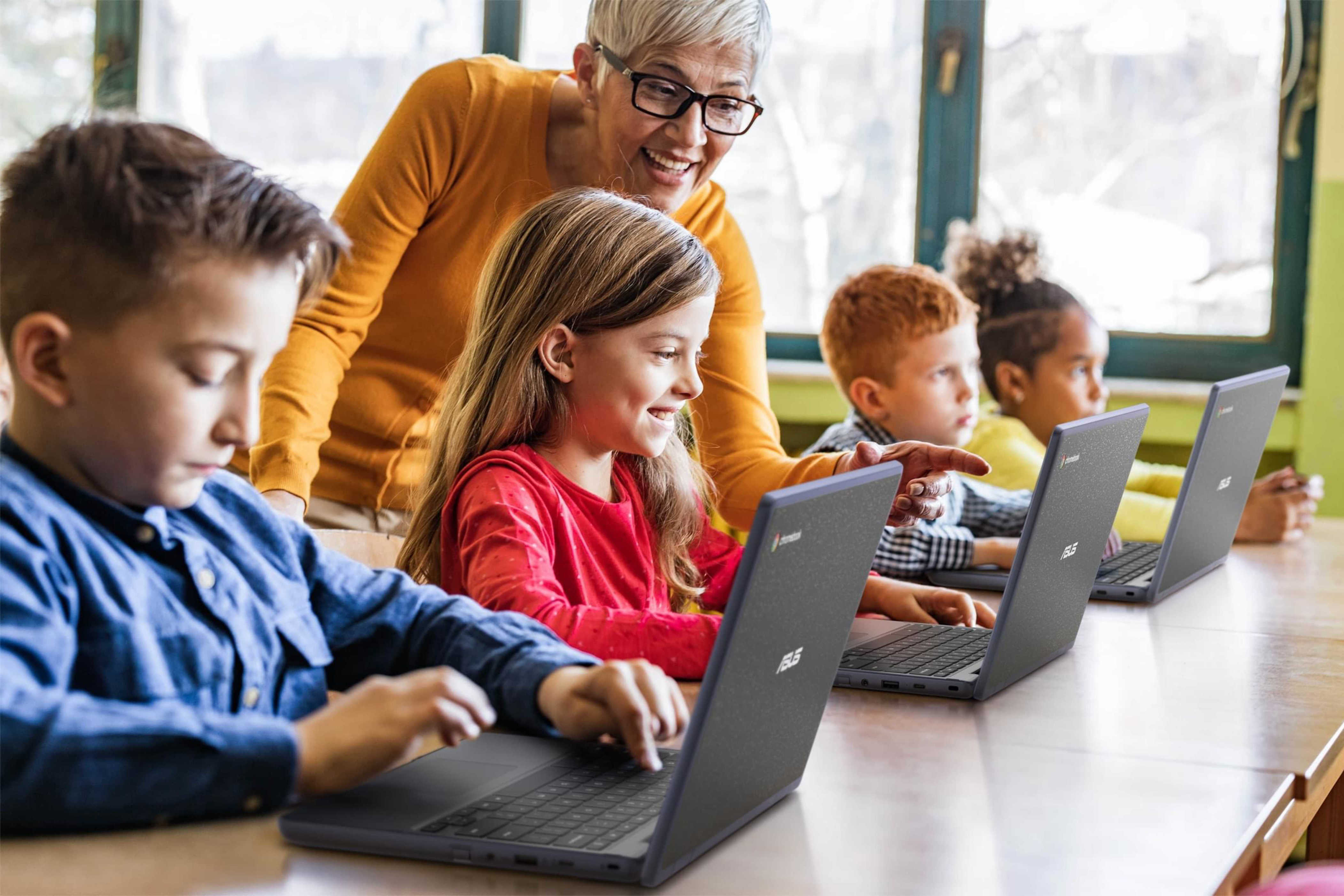 Kids using Asus Chromebooks. 