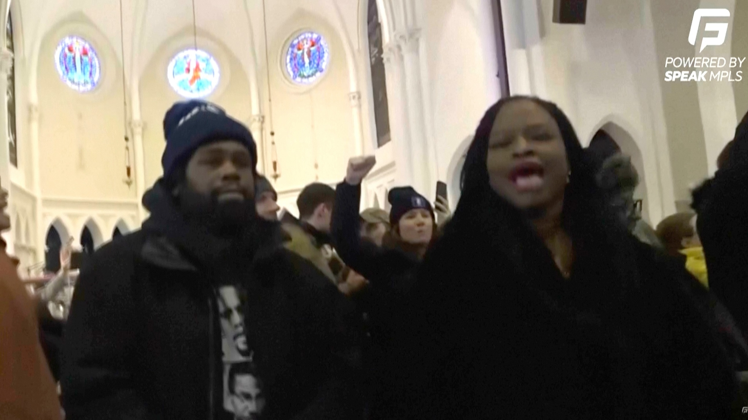 Speak Mpls via AP - PHOTO: A group of protesters interrupt services at the Cities Church in St. Paul by chanting “ICE out” and “Justice for Renee Good," Jan. 18, 2026.