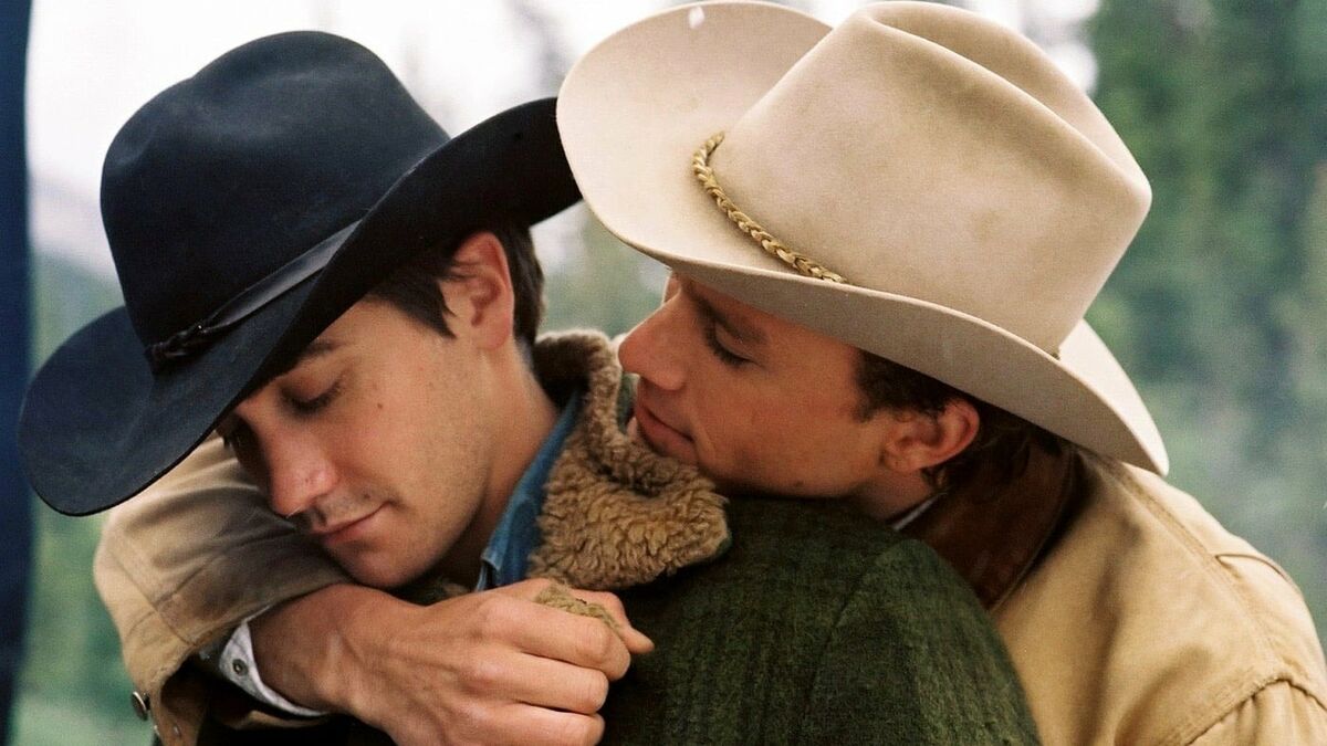 Two cowboy lovers hold each other in