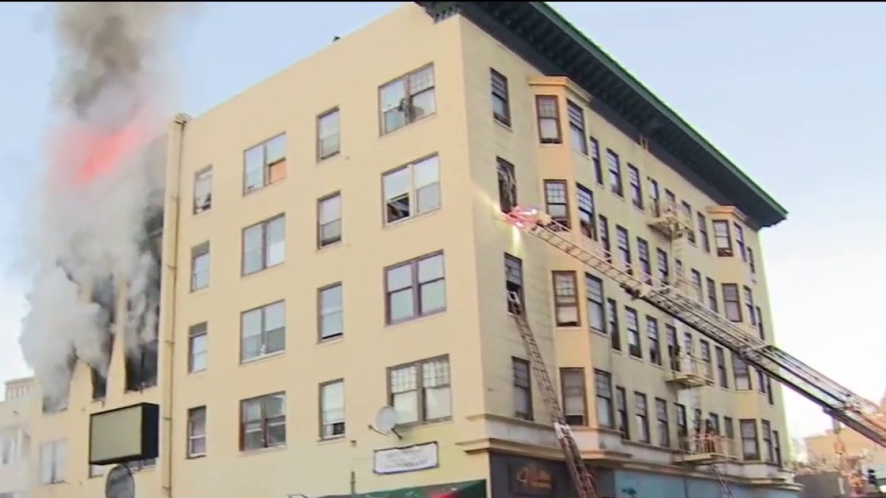 Firefighters battle blaze at downtown Oakland apartment building