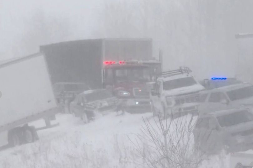 100 car pile-up chaos as snow storm slams into US leaving busy road ...