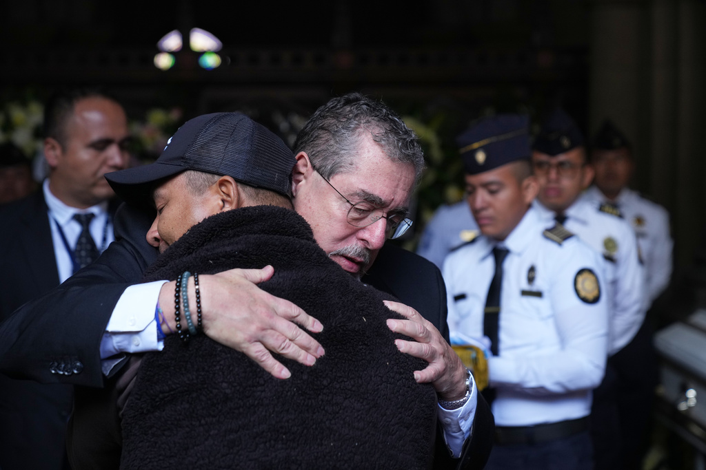 Guatemala mourns 10 police slain by gangsters amid state of emergency