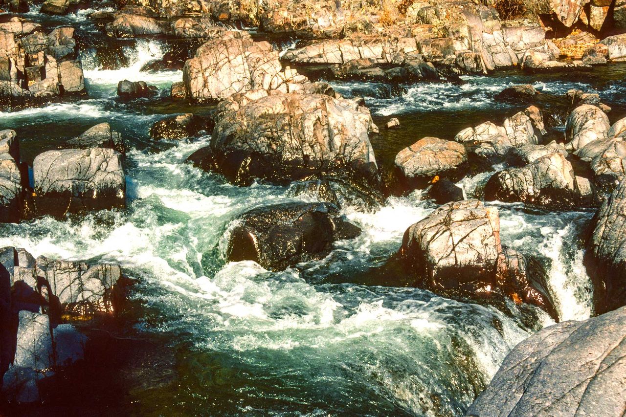 Close up of river water running over walks