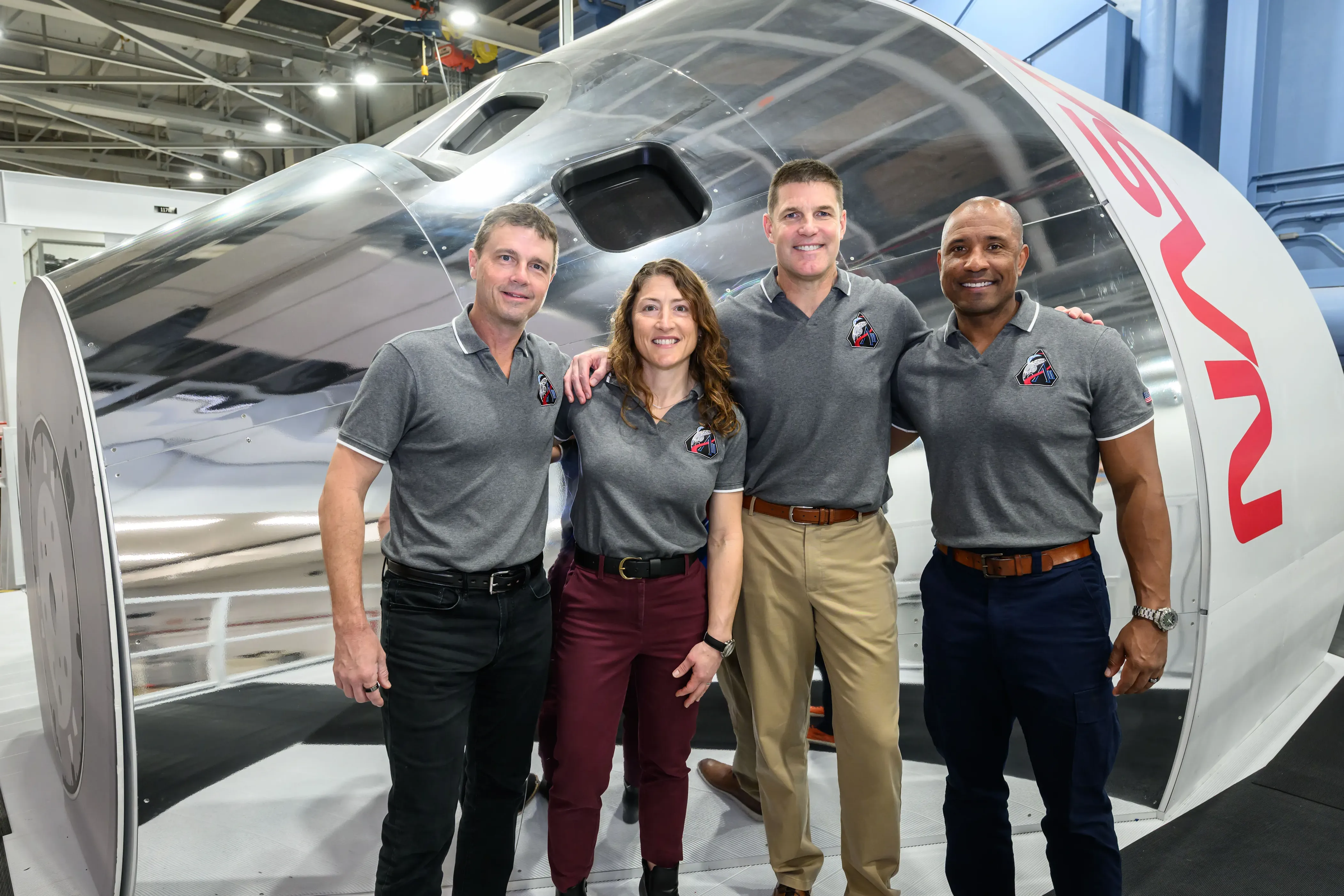 The Artemis II crew poses in front of an Orion simulator Jan. 23, 2026 at NASA&rsquo;s Johnson Space Center in Houston.