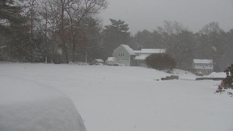 Boston cleans up after powerful winter storm dumps nearly two feet of snow
