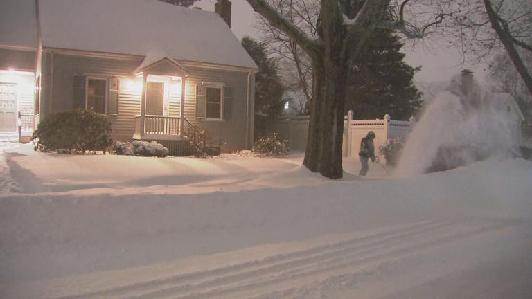 Boston cleans up after powerful winter storm dumps nearly two feet of snow